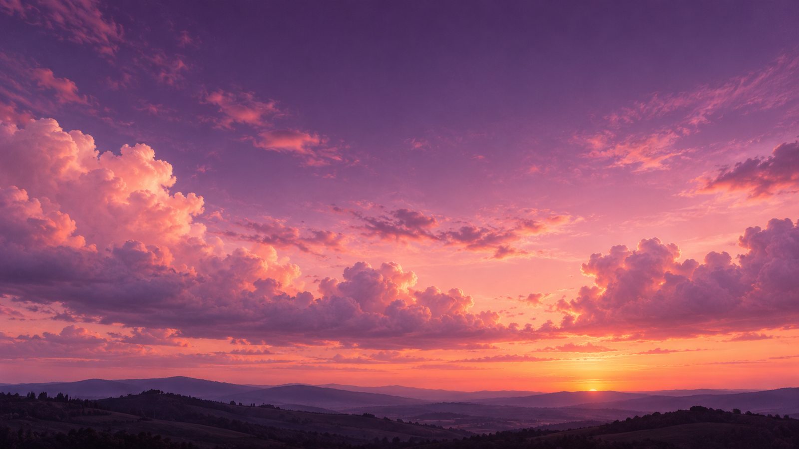A cotton-candy pink and lilac sunset sky over quiet hills